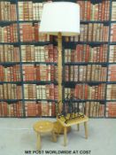Light elm standard lamp in the Ercol style, stool, table,