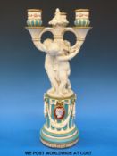 A Minton parian figural candleabra modelled as children standing on a plinth (H37cm)