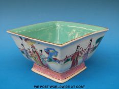 A Chinese porcelain bowl of square form decoraed with court scenes,