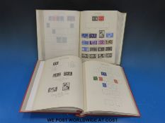 A King George VI Stanley Gibbons stamp album with some mint and used stamps,
