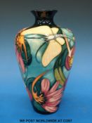 A signed Emma Bossons Moorcroft baluster vase decorated with exotic flowers and butterflies,