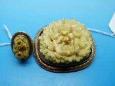 A deeply carved 19thC ivory brooch and ring,