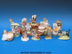 Fourteen Royal Albert Beatrix Potter figures and a Beswick ceramic base