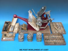 An Adana five-three printing press together with a quantity of printing leads