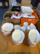 Twenty five Le Crueset style dishes, cruets, ceramics,
