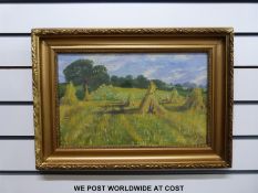 Oil on board, corn stooks in a field,