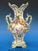 A 19thC Coalbrookdale twin handled vase with applied flower detail (height 27cm)