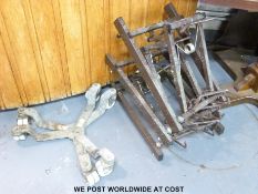 A collection of wine barrel stands and trolleys