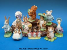 Ten Beswick Beatrix Potter figures and a base