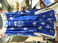 A 19th/20thC Chinese embroidered silk coat with all-over floral decoration and silk lining