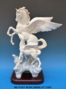 A large Lladro figure of Pegasus and foal on wooden base.