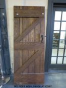 A heavy elm ledged and braced door (196 x 77cm)