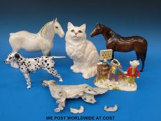A collection of Beswick and other figures to include a dalmatian, a cat, two horses,