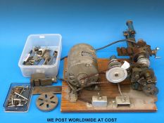 A Perris model engineers lathe together with various accessories to include face plate etc