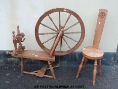 A W.G. Clarke, Arts & Crafts county spinning wheel and stool, both stamped W.G.