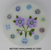 Peter McDougal glass paperweight with central stylized violet surrounded by ten millefiori canes,