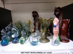 Fifteen Mdina glass seahorse paperweights together with a collection of 'glug' jugs,