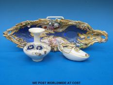 A 19thC porcelain flower encrusted boat-shaped pierced dish and a Zsolnay Pecs vase