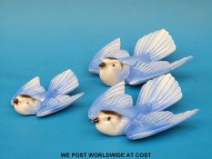 Three Poole pottery graduated bluebird wall plaques