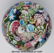 Clichy scrambled glass paperweight with various multicoloured canes, one featuring the letter 'C',