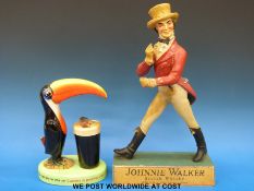 A Carltonware Guinness toucan lamp and a Johnnie Walker figure