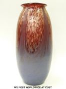 A large Monart glass vase of shouldered ovoid form with collared neck decorated with matt blue base