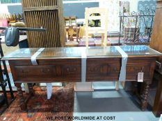 A Georgian style oak three drawer dresser base with protective glass top