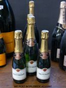 Five dummy Taittinger champagne bottles