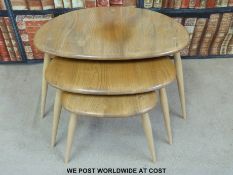 A nest of three Ercol pebble tables