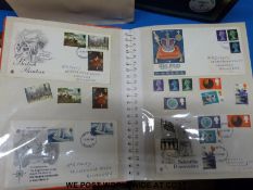 A large quantity of GB first day covers in four albums,