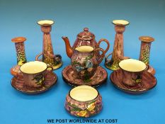 A collection of Longpark Torquay Devon pottery including tea for two and two pairs of candlesticks