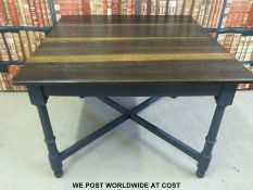 A modern table with painted base (width 106cm)