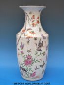 A 19thC Chinese Canton famille vase decorated with prunus blossom and insects (36.