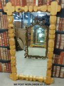 A large carved pine mirror (height 141cm)