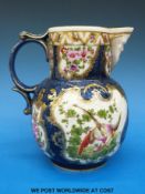 A Worcester style Samson or Paris porcelain blue scale mask jug with blue cross first mark to base