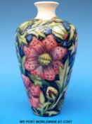 A Moorcroft vase in Snake's Head pattern (height 17cm)