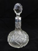 A hallmarked silver mounted cut glass scent bottle (6.