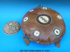 A Kenyan polo cushion together with a woven bowl