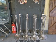 Eight posts for temporary division of space (no rope)