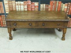 A low oak two drawer table (L106cm)