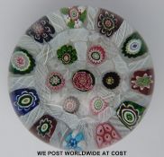 Clichy spaced millefiori glass paperweight with seventeen various canes in two rings around a