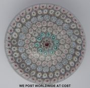 A Whitefriars millefiori paperweight with central large red and white cane surrounded by six rings