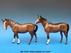 A Beswick standing horse together with another with head turned