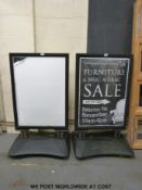 Two spring loaded display signs