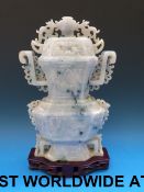 A Chinese pale mottled lavender and apple green jadeite vase and cover of flattened form,