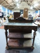 A 19thC carved mahogany marble inset buffet with two undershelves