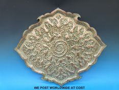A pierced and hand-beaten Eastern copper tray of shaped form decorated with mystical creatures