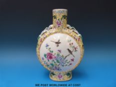 A 19thC Chinese famille jaune moon flask with bird and floral decoration on a yellow ground and
