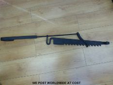 A wrought iron inglenook fire jack