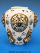 A Zsolnay Pecs Persian-inspired vase with applied and pierced roundels (height 13cm)